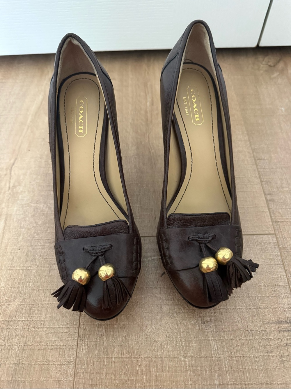 COACH Dark Brown Leather Tassel Pumps with Gold Accents. So 5.5